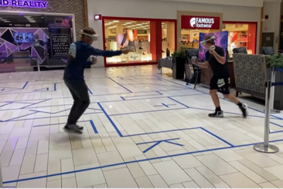 Two People Playing a VR Game in the Mall